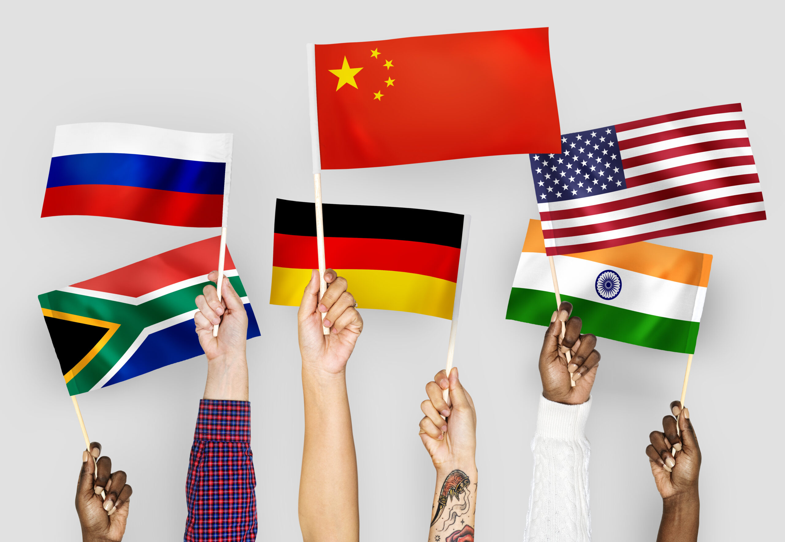 Hands Waving Flags Of China Germany India South Africa And Russia Scaled